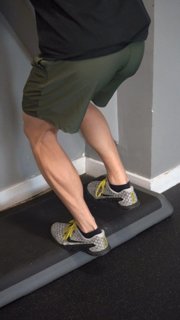 Eccentric Single Leg Heel Raise Knee Bent Off Step P Rehab 0546